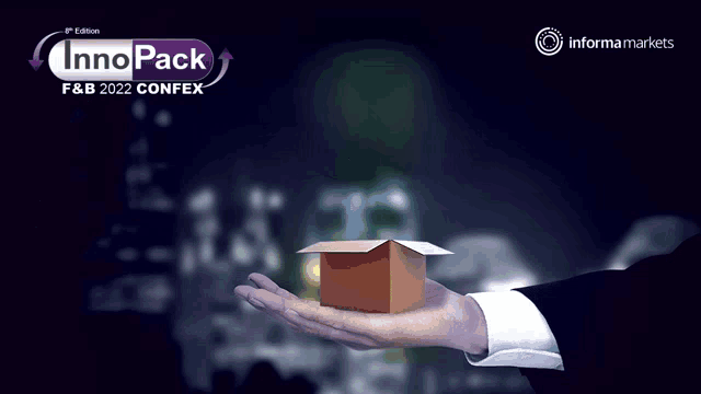 a hand is holding a box with a light bulb growing out of it