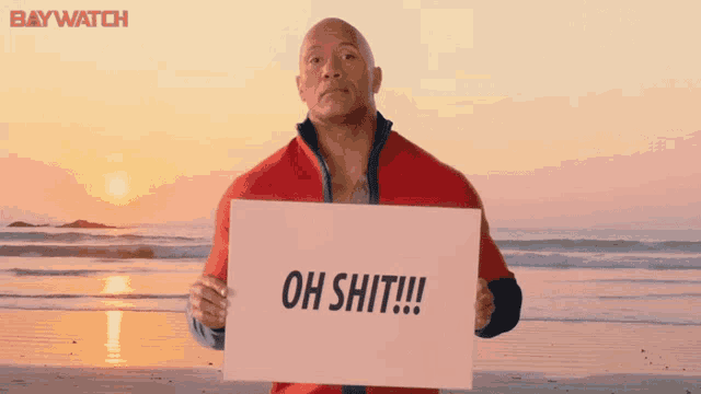 a man holding a sign that says " oh shit "