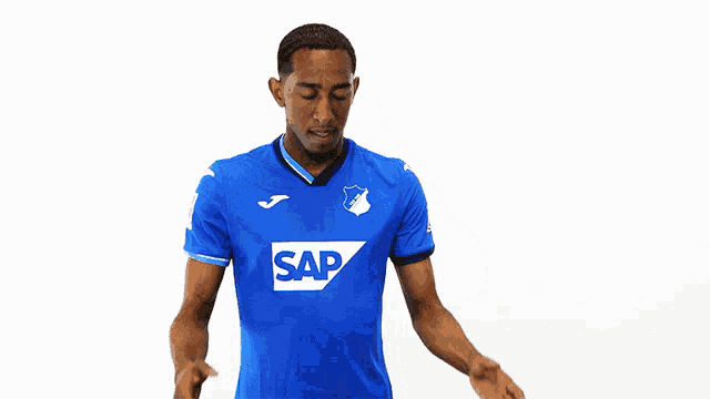 a man wearing a blue shirt with the word sap on the front