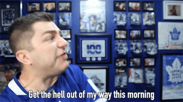 a man in a toronto maple leafs jersey says " get the hell out of my way this morning "