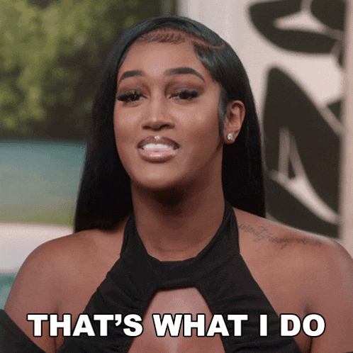 a woman says that 's what i do while wearing a black top