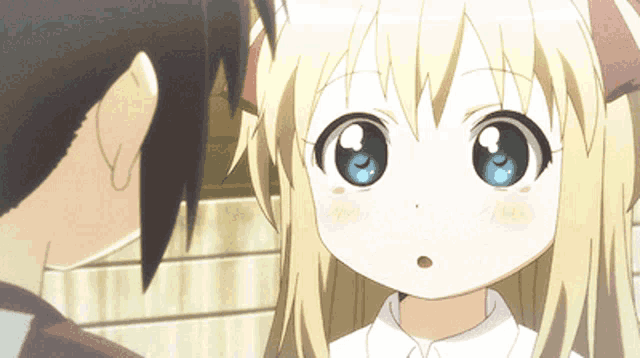 a girl with blonde hair and blue eyes is looking at a man