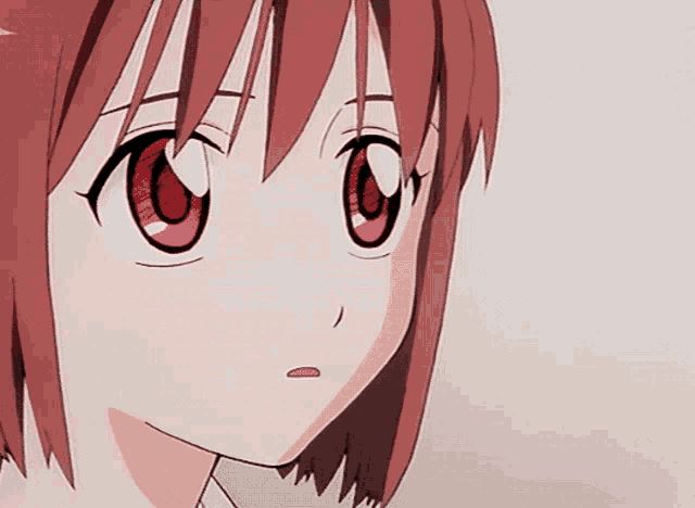 a close up of a girl 's face with red eyes