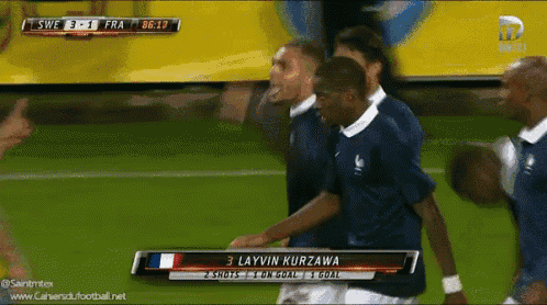 a soccer player named layvin kurzawa is on the field with his teammates