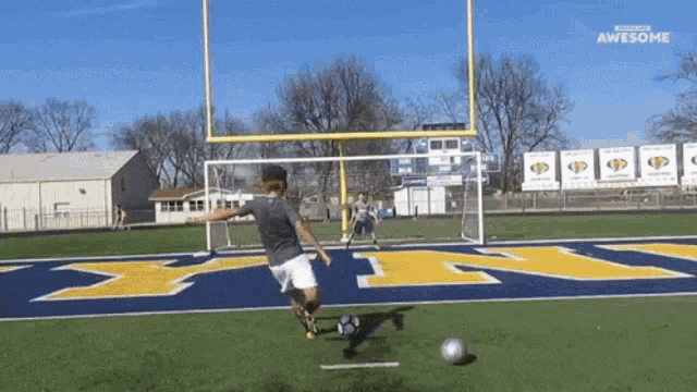 a man kicking a soccer ball on a field that has the word awesome on the bottom