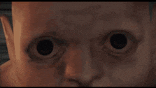 a woman is looking at a monster in a video game while a man stands behind her