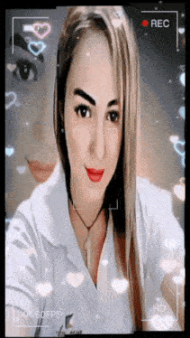 a woman is being recorded in 4k 60fps with hearts around her