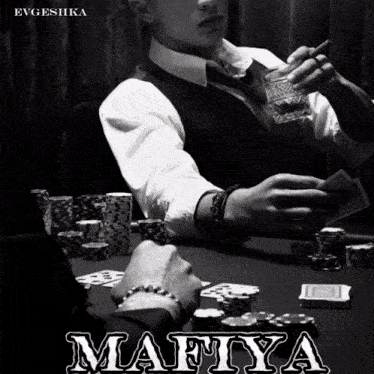 a man holding a glass of whiskey sits at a table with poker chips and the word mafiya