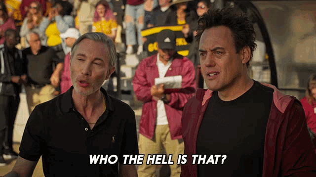 two men standing next to each other with the words who the hell is that written on the bottom