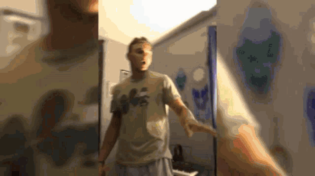 a blurry picture of a man wearing a t-shirt that says abercrombie & fitch