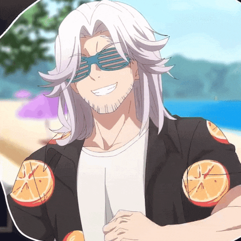 a man wearing sunglasses and a shirt with orange slices on it