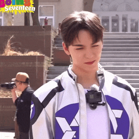 a man is taking a picture of a young man with the words seventeen on the bottom