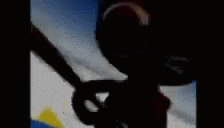a blurry picture of a cartoon character standing on a board