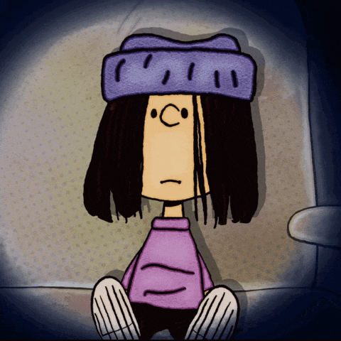 a cartoon character wearing a purple shirt and a purple hat with the letter c on it