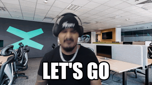 a man wearing headphones says " let 's go "