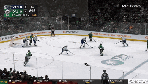 a hockey game between vancouver and dallas is being played on ice