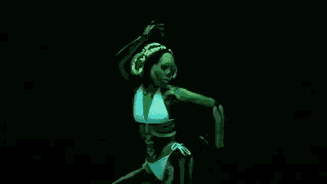 a woman in a bikini is glowing in the dark and dancing in a dark room .