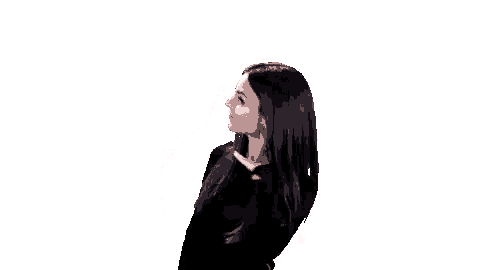 a woman in a black shirt is waving her hair .
