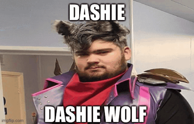 a man wearing a purple jacket and a red scarf with the caption dashie wolf