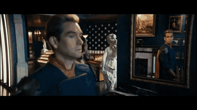 a man is standing in front of a mirror with a statue in the background