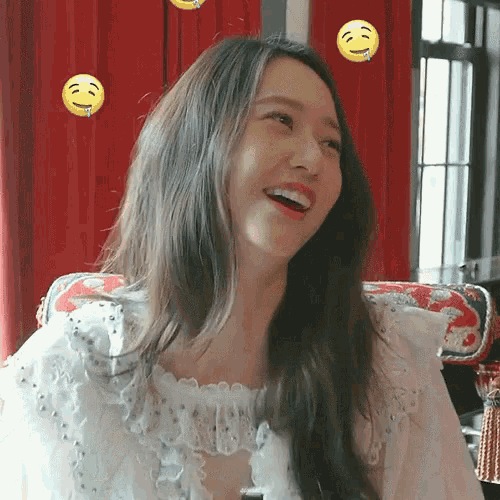 a woman in a white dress is smiling with smiley faces around her