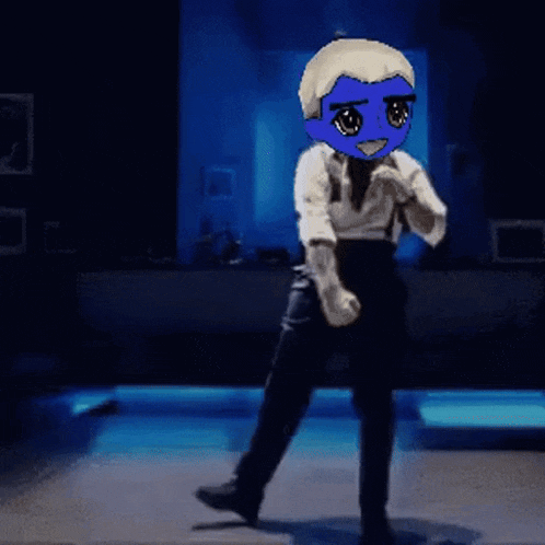 a person with a blue head is dancing on a stage .