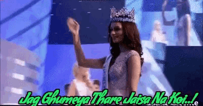 a woman with a crown on her head stands on a stage with the words jag ghumeya thare jaisa na koi