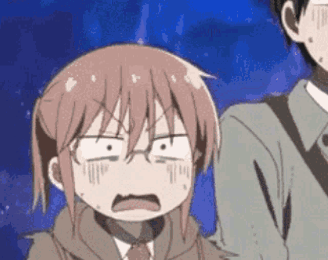 a man and a girl are standing next to each other . the girl is making a funny face .