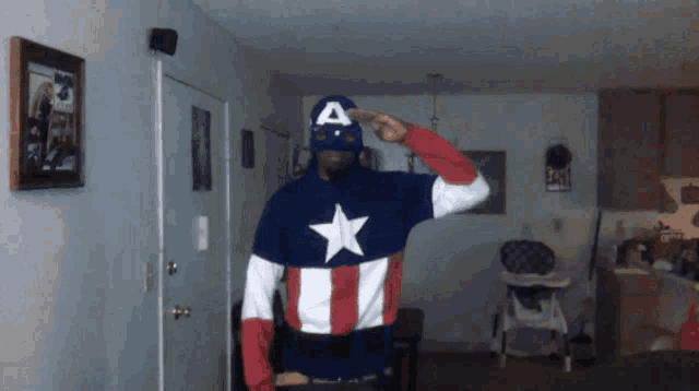 a man dressed in a captain america costume salutes