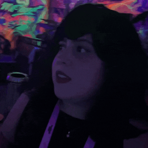 a woman 's face is behind a sign that says wepa on it