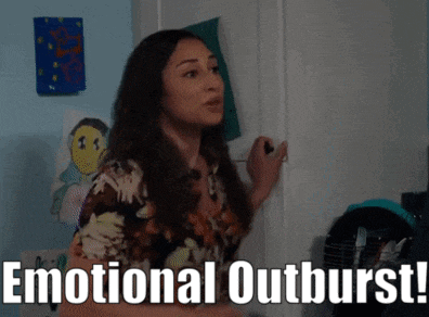 a woman is standing in front of a door with the words emotional outburst written on the bottom