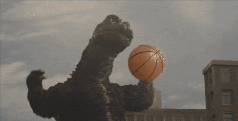a basketball is being thrown by a monster in front of a vw building