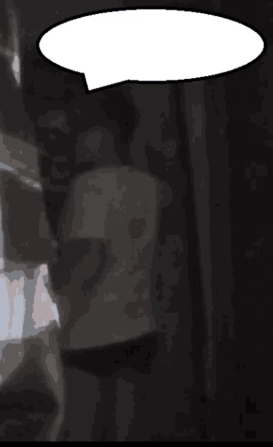 a blurry picture of a person with a speech bubble above their head