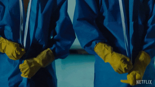two people wearing blue suits and yellow gloves with a netflix logo