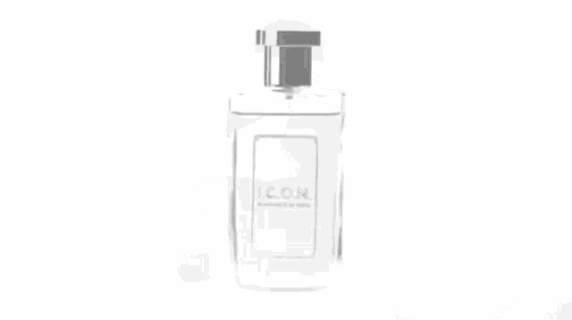 a black and white photo of a man spraying perfume