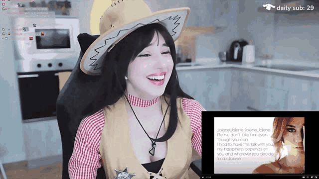 a woman wearing a cowboy hat is laughing in front of a daily sub of 29