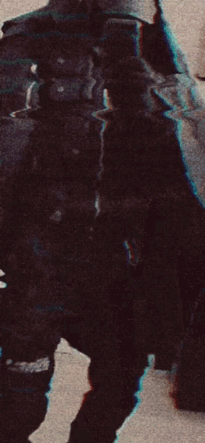 a person is standing in front of a mirror wearing a hat