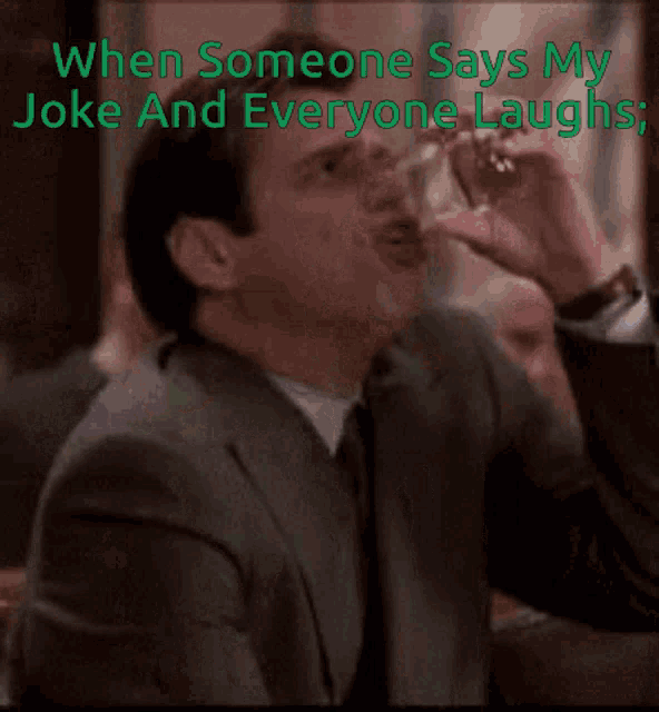 a man in a suit and tie is laughing with the caption when someone says my joke and everyone laughs