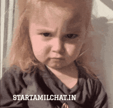a little girl is making a funny face and the website starttamilchat.in is visible behind her