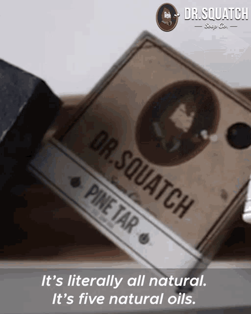 a box of dr. squatch pine tar soap with a picture of a man
