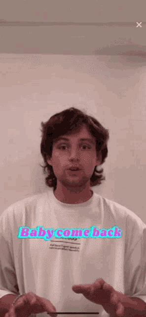 a young man wearing a white shirt that says baby comeback
