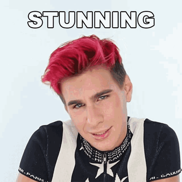 a man with red hair has the word stunning written above him