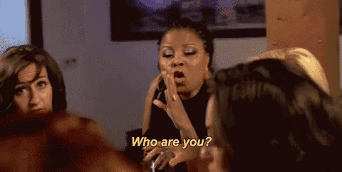 three women are talking to each other and one of them is asking who are you