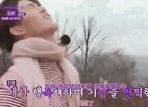 a man is carrying a woman on his back in a video .
