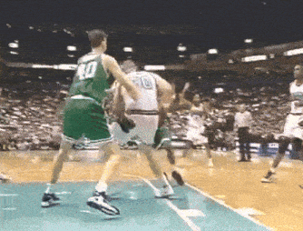 a basketball player wearing a green jersey with the number 40