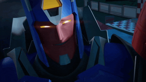 a close up of a robot 's face with glowing yellow eyes