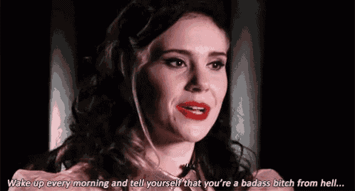 a woman with red lipstick is saying `` wake up every morning and tell yourself that you 're a badass bitch from hell . ``