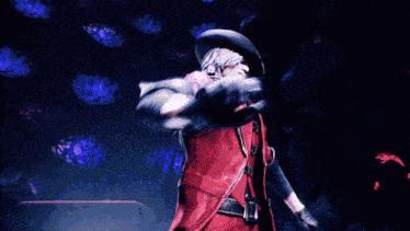 a man in a red jacket and cowboy hat is pointing up