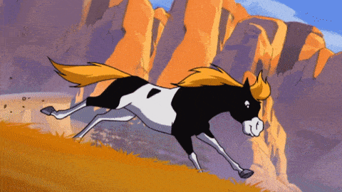 a black and white horse with a yellow mane is running in the desert