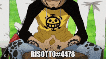 a man in a yellow shirt with a skull on it sits on a box with risotto # 4438 written on the bottom